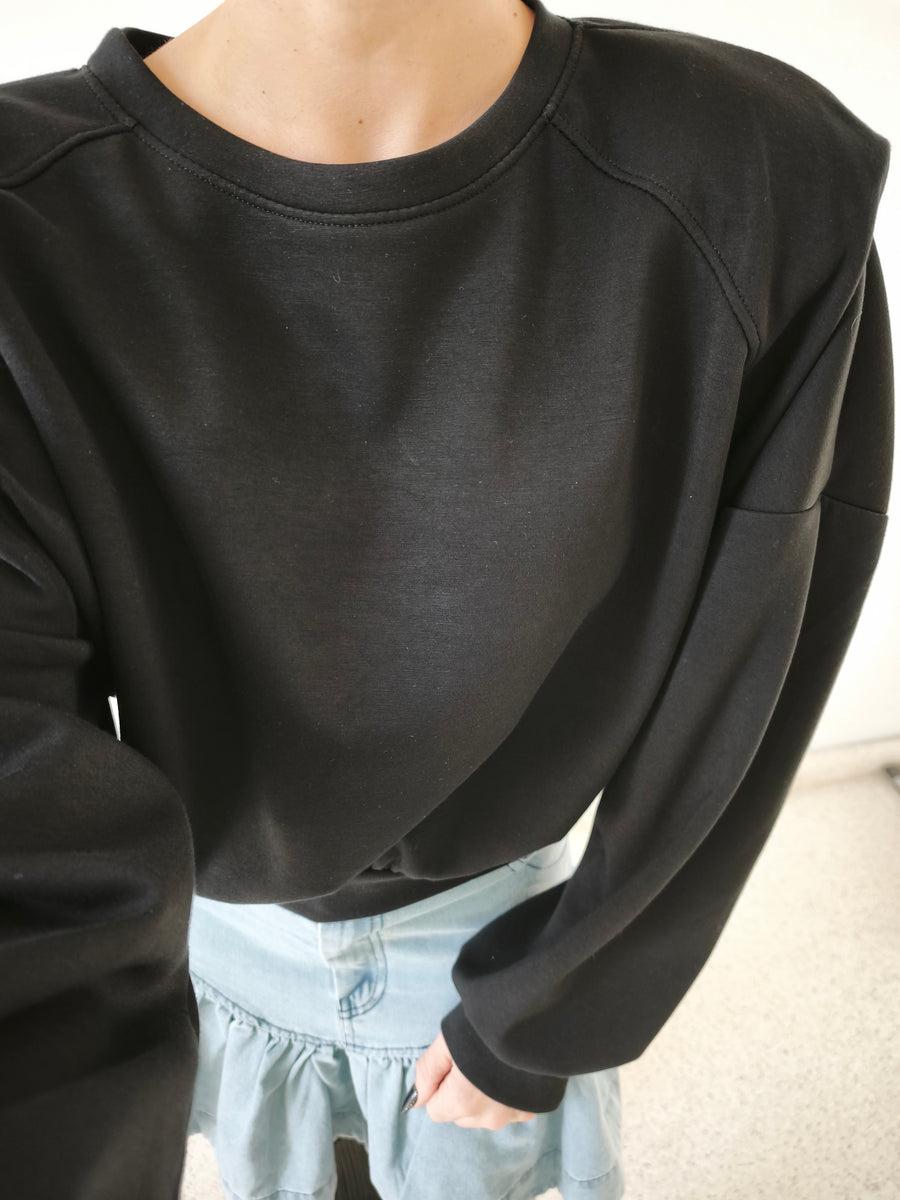Sudadera hombrera. Negro